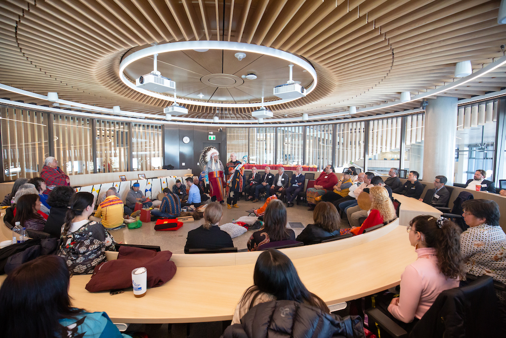 Ceremonial Elders hold a smudging ceremony in the Viewpoint Circle for Dialogue at the University of Calgary